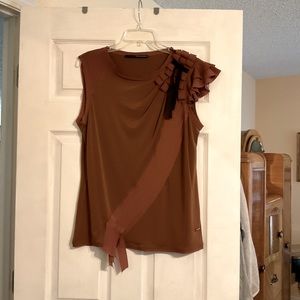 One of a kind designer top. Purchased in Italy. Asymmetrical, cool details.